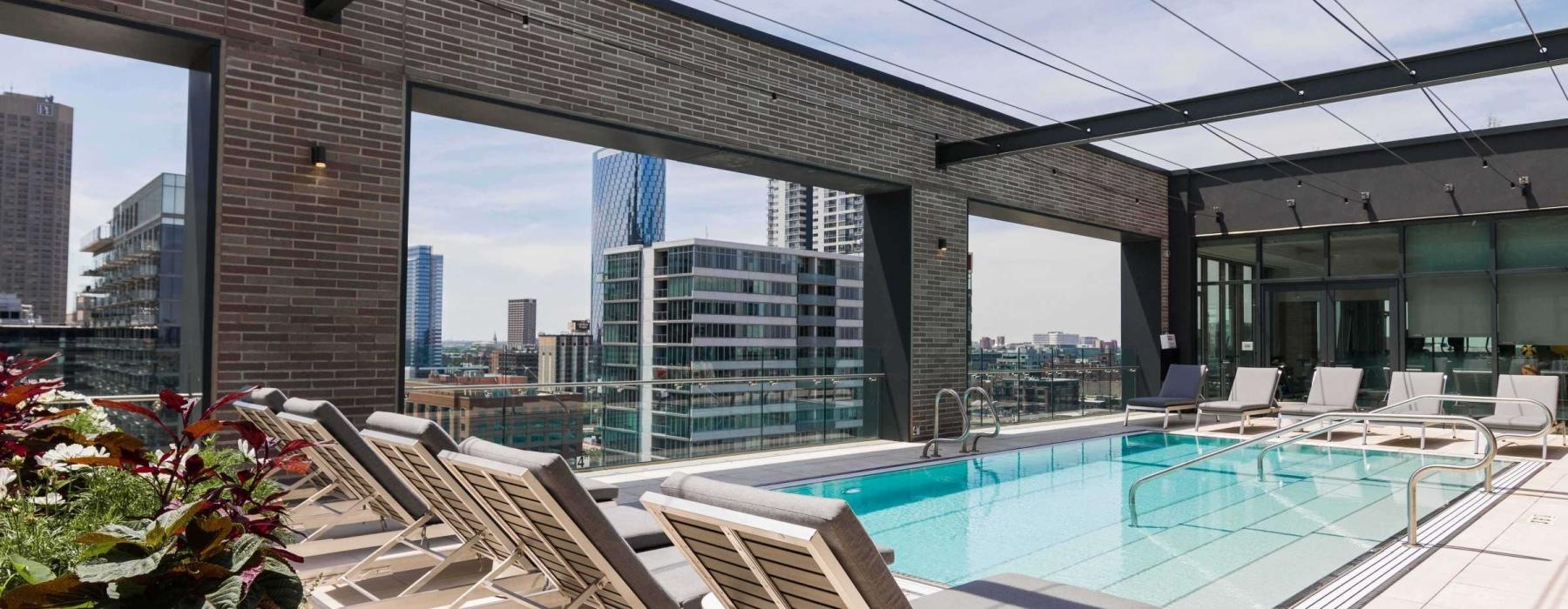 a swimming pool with a view of a city